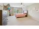Spacious bedroom featuring a ceiling fan, a large window, carpet flooring, and decoratively arranged wall art at 3099 Hidden Falls Dr, Buford, GA 30519