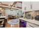 Open-concept kitchen with granite countertops, modern appliances, and a view into the dining area at 3099 Hidden Falls Dr, Buford, GA 30519