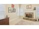 Neutral living room featuring a stone fireplace and lots of natural light at 3099 Hidden Falls Dr, Buford, GA 30519