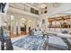 Spacious living room with soaring ceilings, custom built-ins, and large windows that bathe the room in natural light at 3099 Hidden Falls Dr, Buford, GA 30519