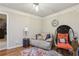 Loft featuring cozy seating and a hanging chair with views of the first floor at 3099 Hidden Falls Dr, Buford, GA 30519