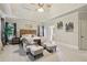Main bedroom retreat features tray ceiling, sitting area and natural lighting at 3099 Hidden Falls Dr, Buford, GA 30519