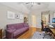 Office with hardwood floors, vaulted ceilings, and a comfortable purple couch at 3099 Hidden Falls Dr, Buford, GA 30519