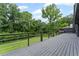 Large back deck offers a tranquil view and ample space for outdoor entertainment at 5254 Greenpoint Drive, Stone Mountain, GA 30088