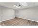 This finished basement with wood-look flooring and neutral paint is ready for your personal touches at 5254 Greenpoint Drive, Stone Mountain, GA 30088