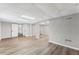 Finished basement features wood-look floors, recessed lighting, and ample room for various activities at 5254 Greenpoint Drive, Stone Mountain, GA 30088