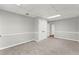 Finished basement with cozy carpet and built-in storage is perfect for recreation or relaxation at 5254 Greenpoint Drive, Stone Mountain, GA 30088