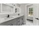 Modern bathroom featuring a double vanity, updated lighting, and sleek fixtures at 5254 Greenpoint Drive, Stone Mountain, GA 30088