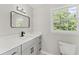 Modern bathroom features a double vanity with elegant countertops and updated fixtures at 5254 Greenpoint Drive, Stone Mountain, GA 30088