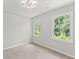 Comfortable bedroom featuring plush carpet and large windows with natural light at 5254 Greenpoint Drive, Stone Mountain, GA 30088