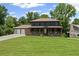 Charming two-story home with a welcoming front porch and lush green lawn at 5254 Greenpoint Drive, Stone Mountain, GA 30088