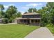 Charming two-story home with a welcoming front porch and lush green lawn at 5254 Greenpoint Drive, Stone Mountain, GA 30088