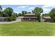 Charming two-story home with a welcoming front porch and lush green lawn at 5254 Greenpoint Drive, Stone Mountain, GA 30088