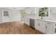 Open kitchen with white cabinets, quartz countertops, stainless steel appliances, and a view to the yard at 5254 Greenpoint Drive, Stone Mountain, GA 30088