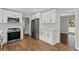 Well-lit kitchen featuring stainless steel appliances, white subway tile, and views to the living room at 5254 Greenpoint Drive, Stone Mountain, GA 30088