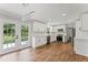 Spacious kitchen with white cabinets, quartz countertops, stainless steel appliances, and deck access at 5254 Greenpoint Drive, Stone Mountain, GA 30088