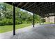Spacious covered patio with concrete flooring, offering an outdoor living space at 5254 Greenpoint Drive, Stone Mountain, GA 30088