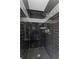 Sleek shower with dark tile and updated fixtures at 5254 Greenpoint Drive, Stone Mountain, GA 30088