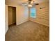 Bedroom with closet, carpet, and ceiling fan at 5688 Baffin Rd, Atlanta, GA 30349