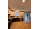 Modern kitchen features granite countertops, stainless steel appliances, and dark brown cabinetry at 5688 Baffin Rd, Atlanta, GA 30349