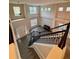 Bright and airy living room, hardwood floors, and ample natural light with staircase at 5688 Baffin Rd, Atlanta, GA 30349