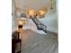 Bright and airy living room with a staircase, hardwood floors, and ample natural light at 5688 Baffin Rd, Atlanta, GA 30349