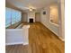 Inviting living room with hardwood floors, a fireplace, and large windows for natural light at 5688 Baffin Rd, Atlanta, GA 30349