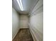 Walk-in closet with carpet and wire shelving at 5688 Baffin Rd, Atlanta, GA 30349
