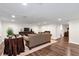 Spacious basement living area with recessed lighting, hardwood floors, and comfortable furnishings at 1320 Northcliff Trce, Roswell, GA 30076