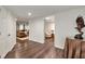 Finished basement hallway with hardwood floors and a glimpse into a cozy seating area at 1320 Northcliff Trce, Roswell, GA 30076