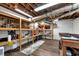 Unfinished basement with wooden shelving and exposed utilities at 1320 Northcliff Trce, Roswell, GA 30076