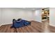 Open basement with new vinyl flooring, door, and storage space at 1320 Northcliff Trce, Roswell, GA 30076