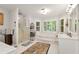 Bright and airy bathroom with a soaking tub, separate shower, and tile flooring at 1320 Northcliff Trce, Roswell, GA 30076