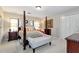 Spacious bedroom with four-poster bed and neutral color palette at 1320 Northcliff Trce, Roswell, GA 30076