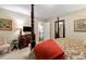 Comfortable bedroom featuring a lavish four-poster bed, paintings, and cozy decor at 1320 Northcliff Trce, Roswell, GA 30076