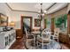 Traditional dining room features a round glass table with seating for four and a bay window at 1320 Northcliff Trce, Roswell, GA 30076