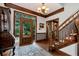 Inviting foyer featuring hardwood floors, staircase, chandelier, and a decorative glass front door at 1320 Northcliff Trce, Roswell, GA 30076