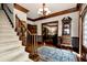Welcoming foyer showcasing hardwood floors, staircase, chandelier, and access to multiple rooms at 1320 Northcliff Trce, Roswell, GA 30076
