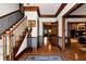 Open foyer featuring hardwood floors, staircase, wainscoting and views of living spaces at 1320 Northcliff Trce, Roswell, GA 30076