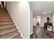 Basement hallway with carpeted stairs, hardwood floors, and decorative accents at 1320 Northcliff Trce, Roswell, GA 30076