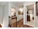 Upstairs hallway with hardwood flooring and views into bedrooms and bathrooms at 1320 Northcliff Trce, Roswell, GA 30076