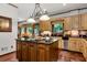 Traditional kitchen with light stained cabinets, dark counters, and a stainless steel dishwasher at 1320 Northcliff Trce, Roswell, GA 30076