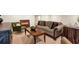 Living room featuring a comfortable sofa, stylish accent chairs, and elegant decor at 1320 Northcliff Trce, Roswell, GA 30076