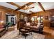 Traditional living room with hardwood floors, paneled walls, and comfortable seating at 1320 Northcliff Trce, Roswell, GA 30076