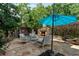 Outdoor patio with a stone fireplace, comfortable seating, and a serene ambiance, perfect for relaxing outdoors at 1775 Porterton Way, Cumming, GA 30041
