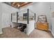Unique bedroom with a raised bed platform, carpeted floor, and a vintage-style dresser at 1775 Porterton Way, Cumming, GA 30041