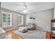 Neutral bedroom with wood floors, shutters and beanbag chair at 1775 Porterton Way, Cumming, GA 30041