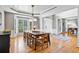 Elegant dining room with hardwood floors, bay window, and open layout at 1775 Porterton Way, Cumming, GA 30041