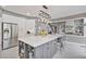 Well-appointed kitchen features a large island with seating, stainless appliances and plenty of counter space at 1775 Porterton Way, Cumming, GA 30041