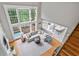 Bright and airy living room featuring large windows, sectional and hardwood floors at 1775 Porterton Way, Cumming, GA 30041